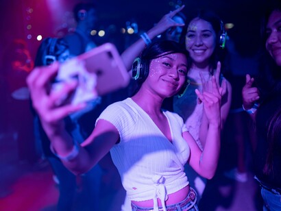 Woman enjoying music with her friends at a club