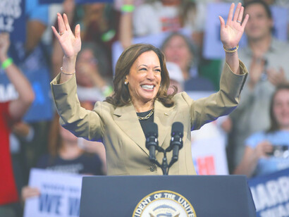 Kamala Harris beams with optimism as she rallies the crowd, embodying a vision of hope for a brighter future for all Americans