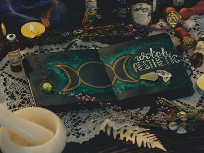 Vials, teacups, books, and candles arranged to signify mythical realms