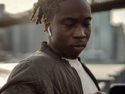 Lost in the glow, he disconnects from the climb towards success, opting instead for fleeting diversions