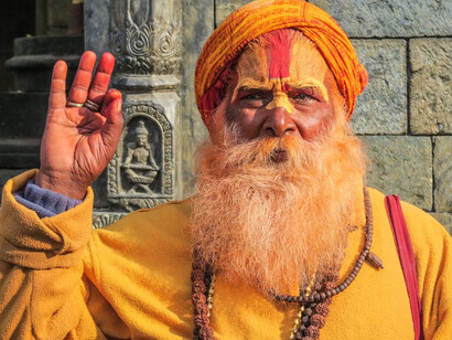 Sadhus are Hindu ascetics who renounce worldly attachments to seek spiritual enlightenment, often living in solitude or in communities dedicated to meditation and prayer