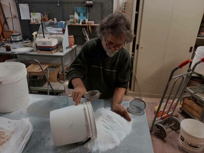 Joan Crous mixing in some materials for his latest project