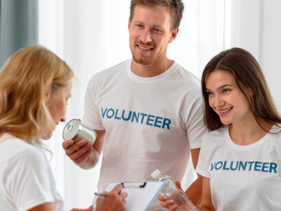 Volunteers are actively organizing and packing boxes for charitable donations