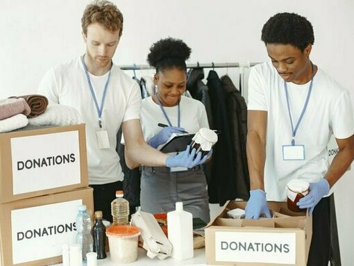 A team organizing relief supplies, symbolizing the tangible impact of community-driven compassion
