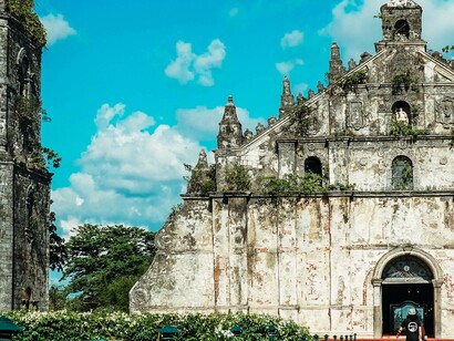 A man walking into Paoay Church in Paoay, Ilocos Norte, Philippines