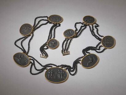 Necklace in cast-iron with nine 'cameos' in gold collet settings, linked by festoons of fine iron chain, Germany, 1805 © The Trustees of the British Museum