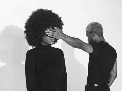 A man covers his girlfriend's eyes. By pretending that what happens doesn't happen