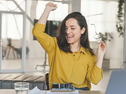A young businesswoman is consulting her tablet, seeking information