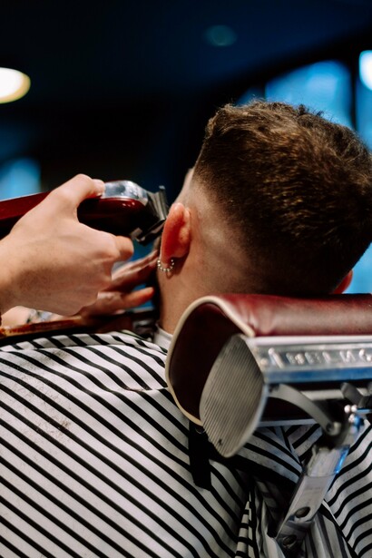 A man investing in his personal grooming, representing the impact of grooming on perceived competence and trustworthiness