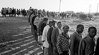 South Africa's first democratic voting day on the 27th of April, 1994, the queues of voters serving as a powerful symbol of the collective journey towards democracy, echoing the aspirations of a nation reborn
