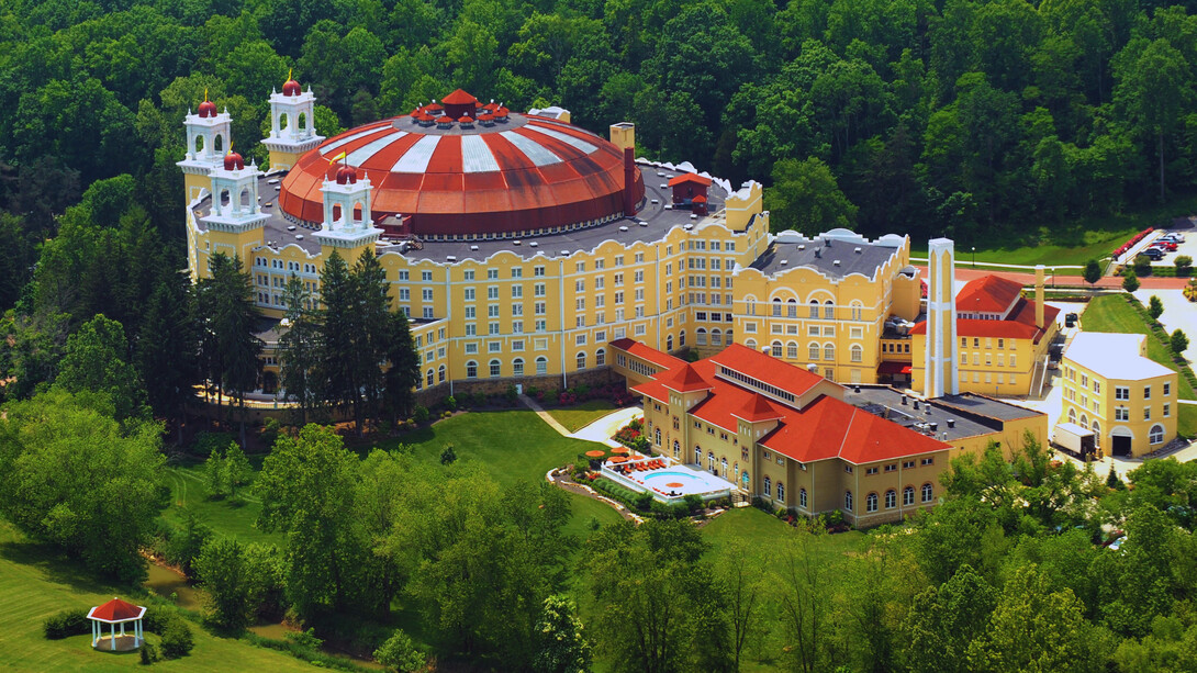 A panoramic view of the legendary West Baden Springs Hotel, Indiana, showing the harmony between architectural brilliance and natural beauty