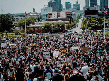 A large crowd gathers in downtown Des Moines during a Black Lives Matter protest, calling for racial equality, social justice, and an end to systemic discrimination