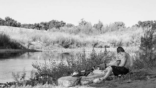 Katy Grannan, April and Robert on mattress under 9th Street bridge, Modesto, CA, 2014