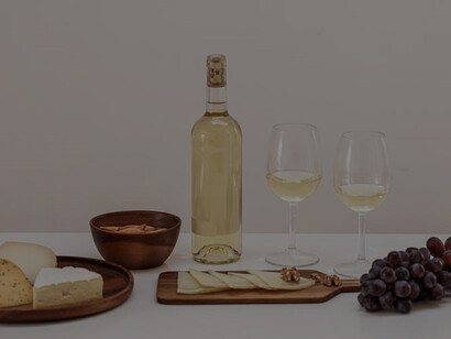 Assorted cheeses and wine glasses elegantly displayed on a table
