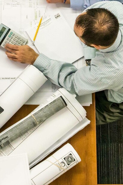 Man making financial calculations for proposal