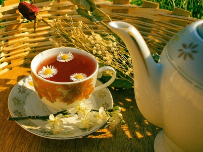 A warm cup of herbal tea presented aesthetically, symbolising the simple habits that support heart health and relaxation