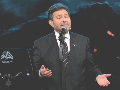 Hany Abdel Aziz Shaker was a celebrated Egyptian singer, actor, and composer. His early career included performing with Abdel Halim Hafez’s choral group in "Sora" and portraying the young Sayed Darwish in the film Sayed Darwish
