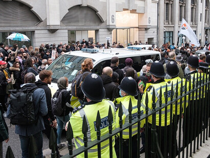 Passionate crowd gathers at a momentous rally in Central London, raising their voices for change and justice amidst a vibrant and charged atmosphere, London, the UK
