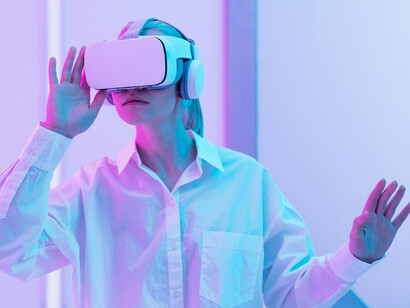 A woman engaged in a virtual reality experience, analyzing the challenges of bias in artificial intelligence