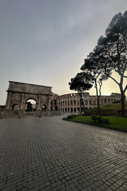 The Arch of Constantine, an honorific monument from the 1st century AD, stands majestically along the Via Sacra in Rome, Italy