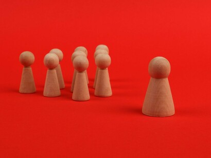 A leader stepping forward from the group, representing the responsibility of guiding others through uncertainty and division