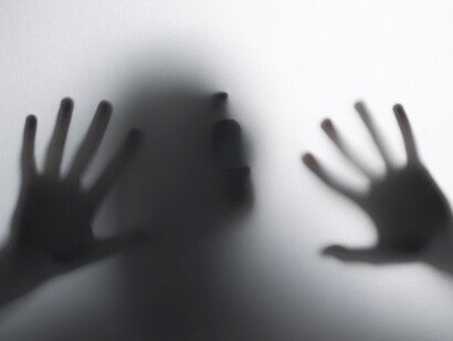 A scream for help, a shadow figure showing desperation that domestic violence causes 