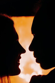 As the flames dance, as the shadows flicker, this couple finds solace in each other's embrace amidst the turmoil of modern relationships, highlighting the enduring warmth of genuine connection amidst a world plagued by superficiality and uncertainty