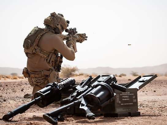 A French special forces operator from Task Force Takuba in the Sahel, with a Milkor Multiple Grenade Launcher visible in the foreground (2 June 2022)
