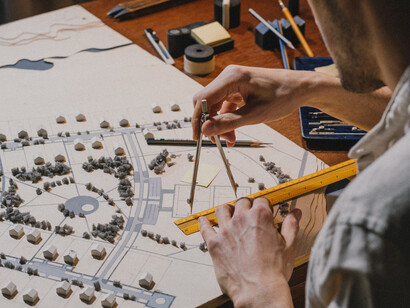 An architect is measuring spatial differences