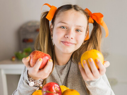 Child checking a product label at the supermarket, learning to make healthy choices