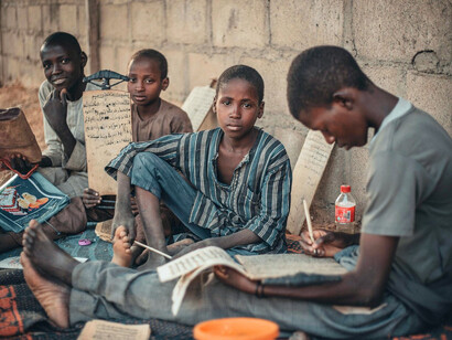 A group of young learners studying, expressing the determination to build a better Nigeria