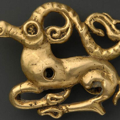 Openwork gold belt fitting in the form of a recumbent ibex. Western Eurasian steppe. 6th to 4th century BCE. 4.49 x 5.53 cm. The al-Sabah Collection, Dar al-Athar al-Islamiyyah, Kuwait.