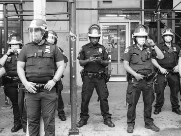 Photo of a group of police officers in a modern city