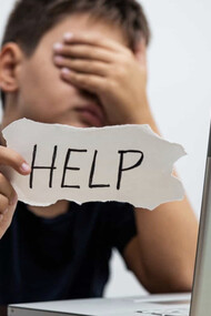 Child asking for help from cyber bullying