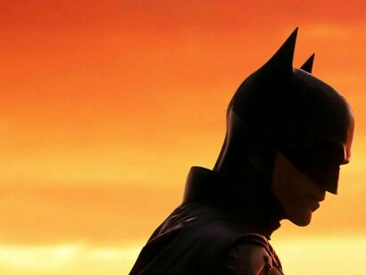 Batman contemplating his next move at sunset