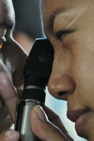 A doctor examining a patient thoroughly leaving no stone unturned