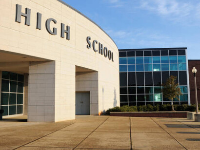 The entrance to the high school campus is located near the main street