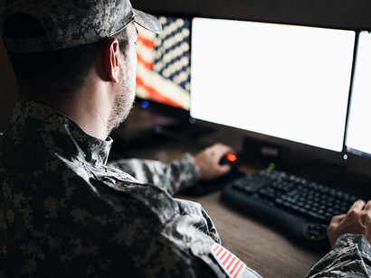 U.S. military personnel working in a central operations center during a strategic mission