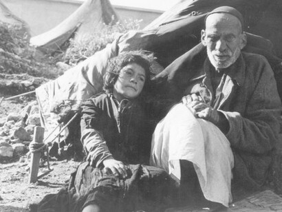 An elderly man and a girl depicted during the Nakba in Palestine, 1948, reflecting displacement