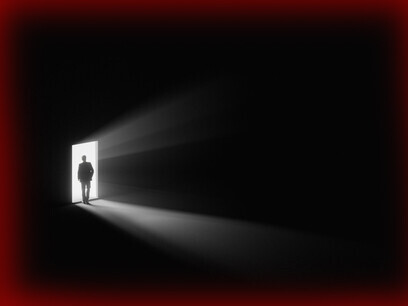 A dark room lit by a ray of light; the speaker in the author's experience promises the ultimate secrets but fails
