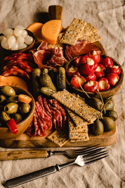 Snacks displayed on a brown wooden tray