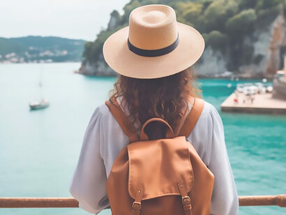 A fashionable adventurer, backpack strapped and hat donned, as she discovers alluring travel destinations and embraces enriching cultural experiences