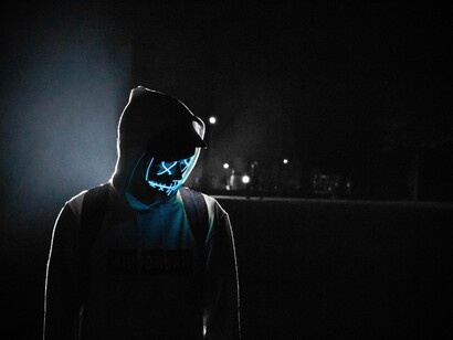 A person in black has a choice to make between darkness and the light