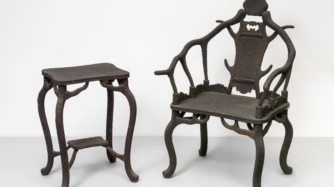 Zheng Guogu, Impacted Chairs, 2011, African ebony, Chair: 115 x 50 x 73 cm, 45 1/4 x 19 3/4 x 28 3/4 inches, Tea Table: 71 x 36 x 46 cm, 28 x 14 1/4 x 18 inches