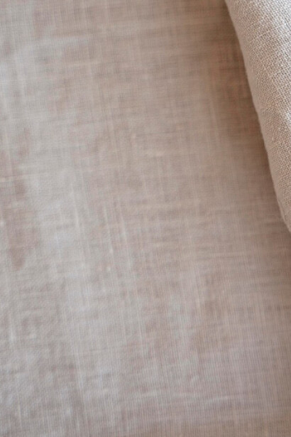 A close up of linen and its harmony of smooth lines 