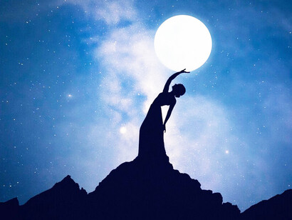 Under the Aquarian New Moon, a person's silhouette connects with the cosmos, embracing its energy