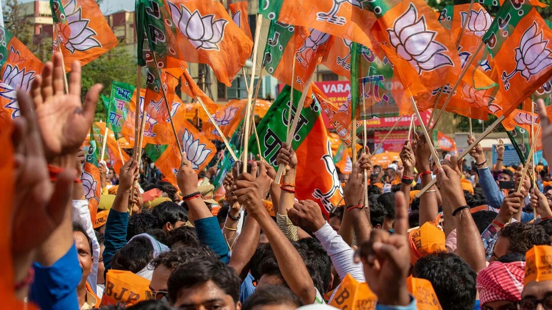 Bharatiya Janata Party (BJP) members celebrating in the streets of India