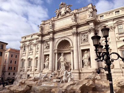 The god Oceanus springs from the central niche on a shell chariot pulled by two hippocamps and two cascading tritons, The Trevi Fountain, Rome, Italy