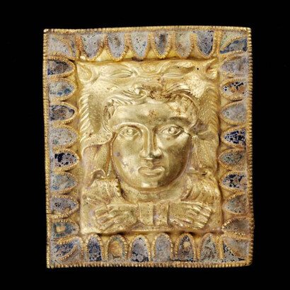 Gold plaque with enamel decoration framing the bust of Heracles. Central Asia or Black Sea region, Hellenistic period. ca. 2nd century BCE. 4.2 x 3.7 cm. The al-Sabah Collection, Dar al-Athar al-Islamiyyah, Kuwait. 