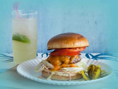 "Cheeseburger in paradise" is another well known song by Jimmy Buffett